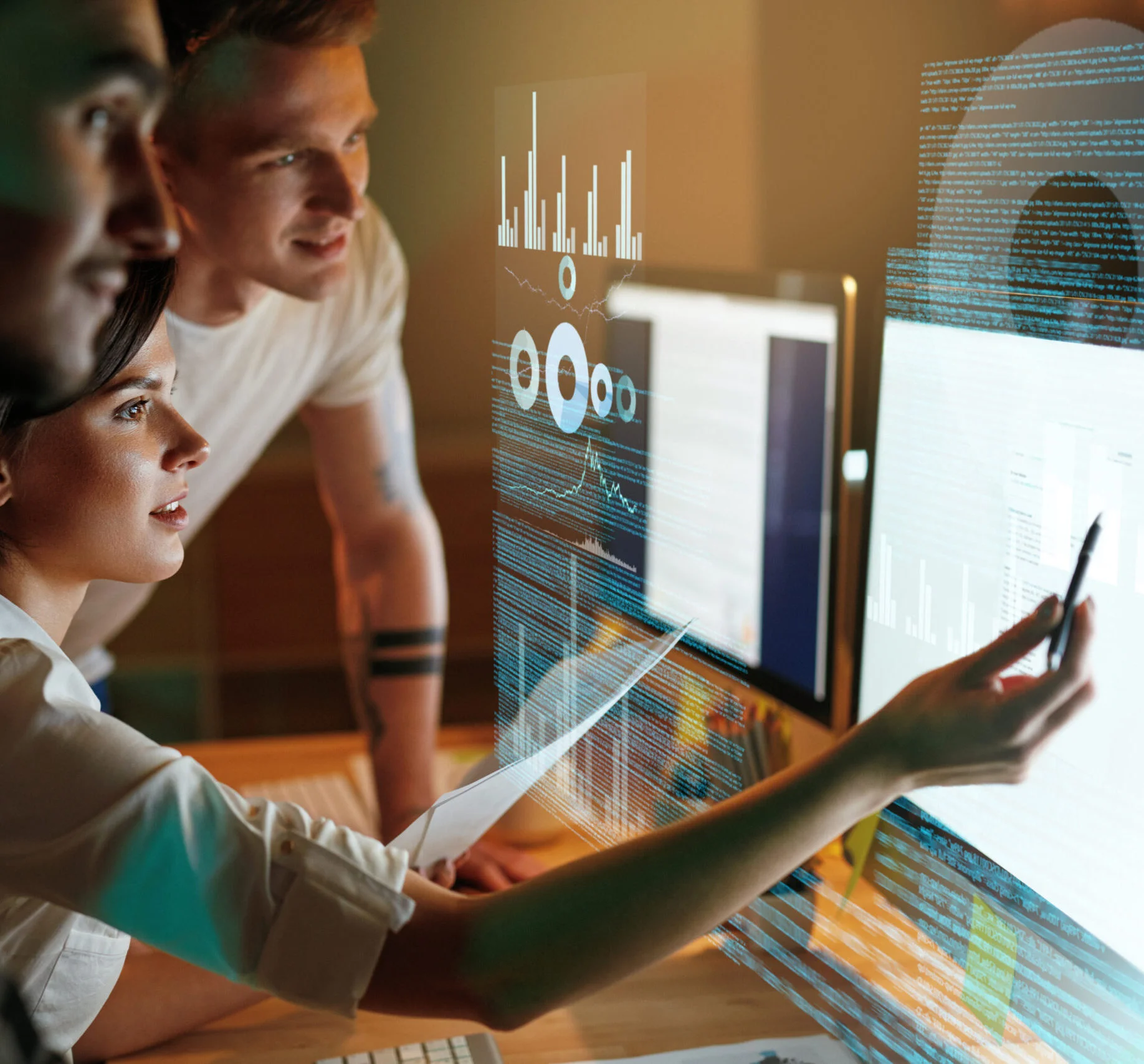 Person pointing at computer screen with data analysis graphs.